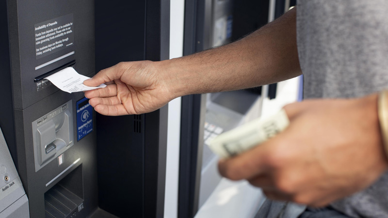 ATM customer getting account mini statement.